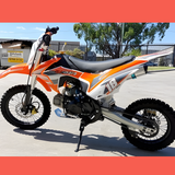 side view of MJM 110cc Petrol Powered 4-Stroke Kids Trail Pit Dirt Bike - Orange