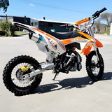 side view of MJM 110cc Petrol Powered 4-Stroke Kids Trail Pit Dirt Bike - Orange