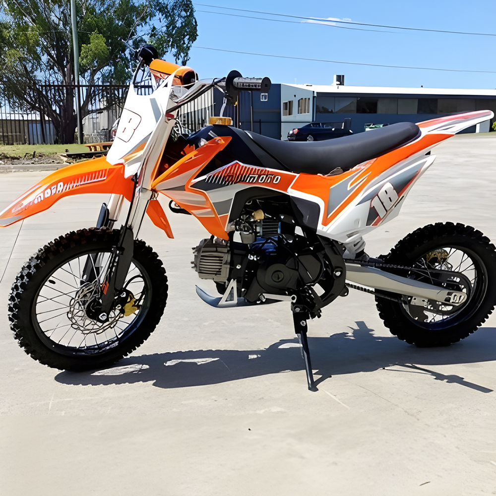 side view of MJM 110cc Petrol Powered 4-Stroke Kids Trail Pit Dirt Bike - Orange