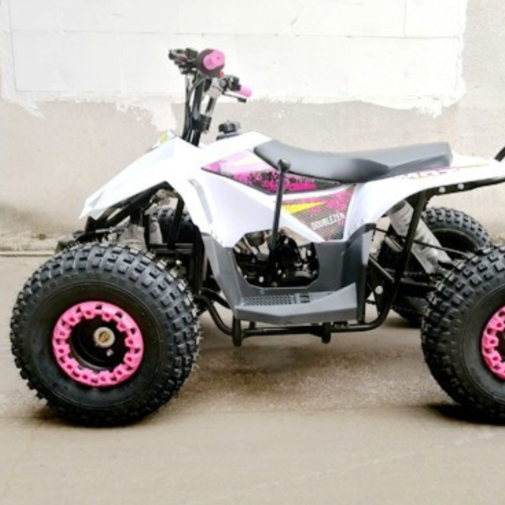 White ATV with pink accents on a concrete floor