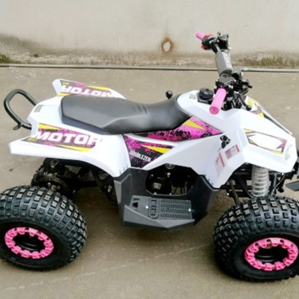 White and pink quad bike on a concrete surface