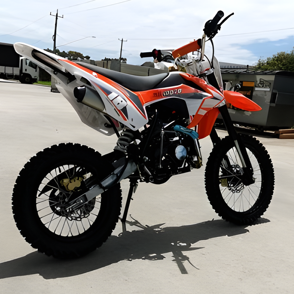 side view of MJM 125cc Petrol Powered 4-Stroke E-Start Kids Dirt Bike - Orange