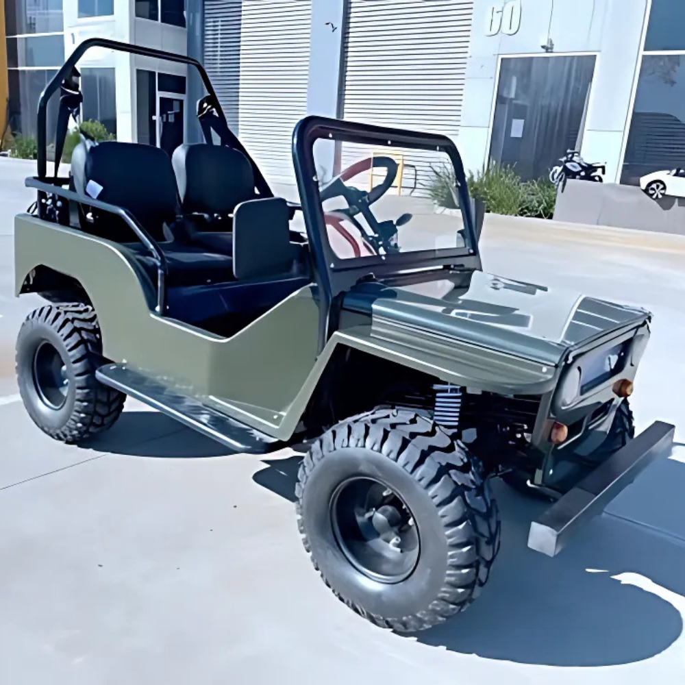 Small off-road vehicle on a concrete surface with a building in the background