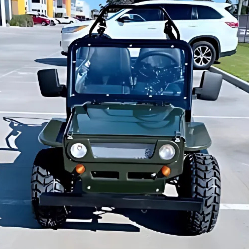 Small off-road vehicle on a parking lot with a white SUV in the background.