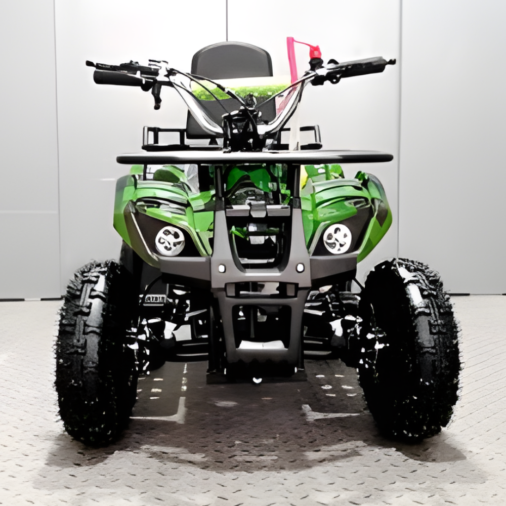 Green and black ATV on a white floor with a gray wall background
