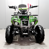 Green and black ATV on a white floor with a gray wall background