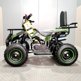 Small off-road vehicle with green wheels on a gray floor.