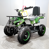 Green and black ATV on a white floor with a white wall background