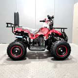 Red and black ATV on a gray floor with a white wall background