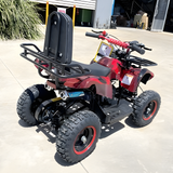 Red and black ATV with a small trailer attached on a concrete surface.