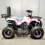 Black and pink ATV on a metallic floor with a white wall background