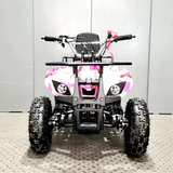 Children's ATV with pink and white design on a metallic surface