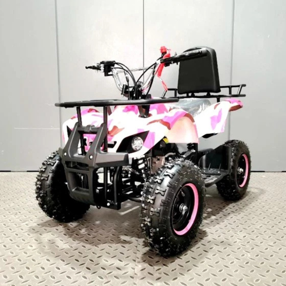 Small ATV with pink and white camouflage seat on a gray floor.