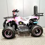 Small ATV with pink accents on a gray floor against a white wall