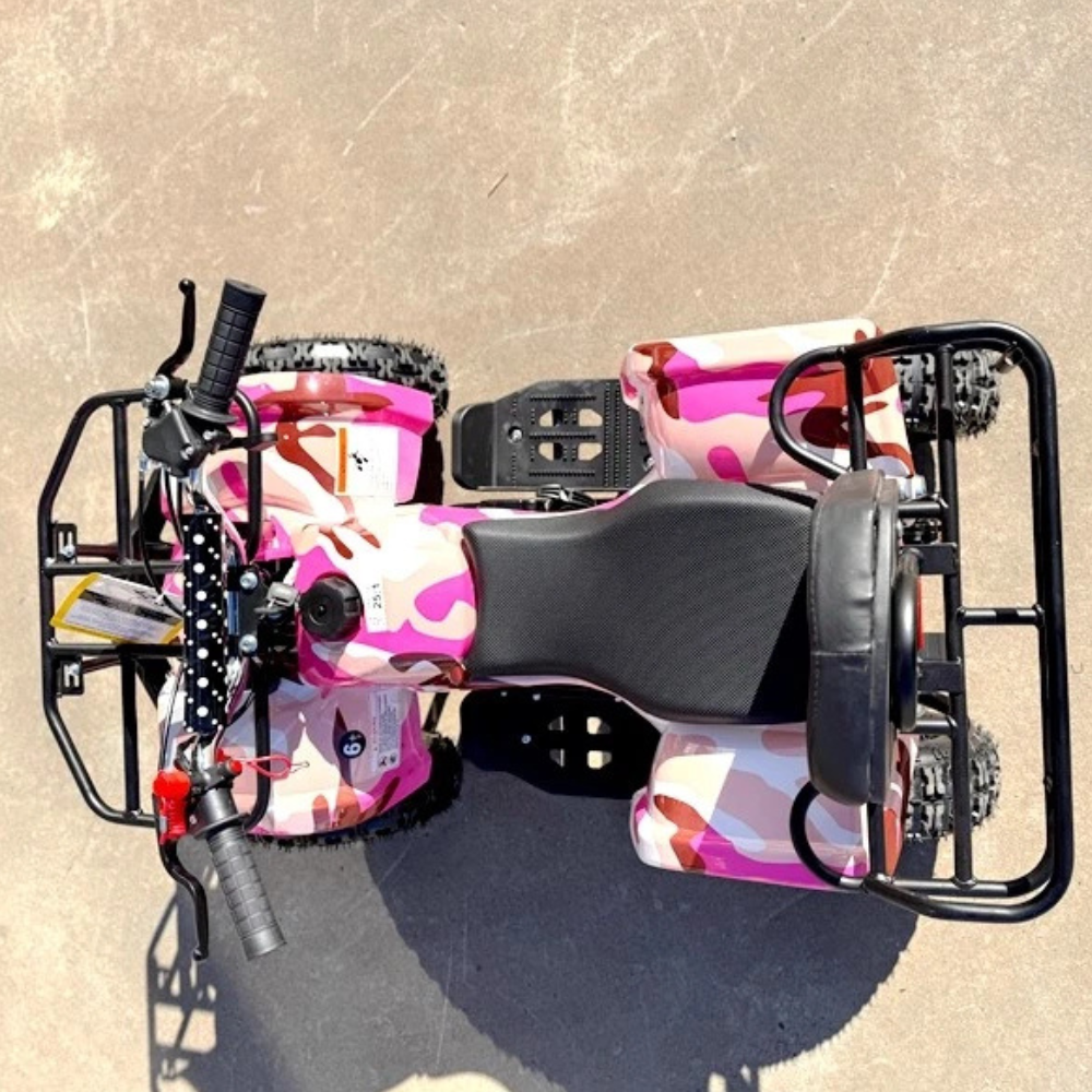 Pink and black scooter on a beige surface