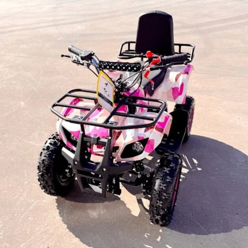 Pink and black ATV on a sandy surface