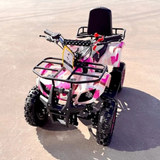 Pink and black ATV on a sandy surface