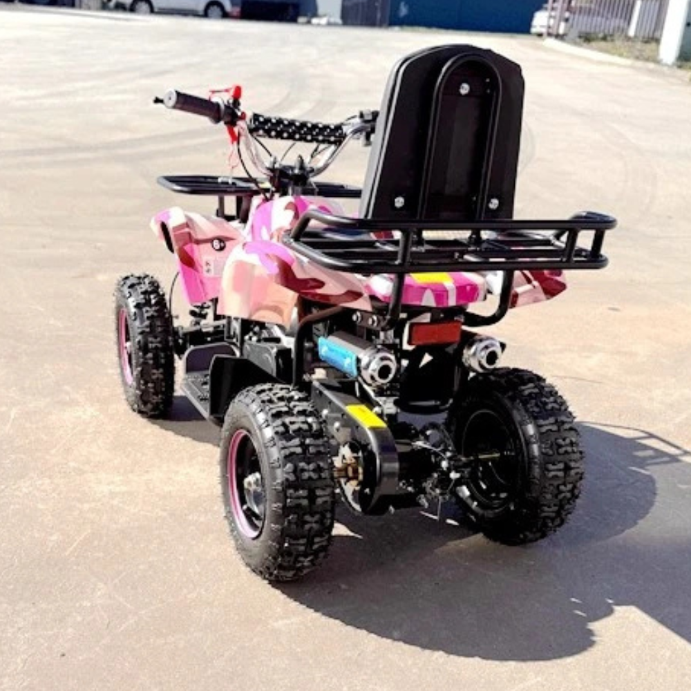 Pink and black quad bike on a paved surface