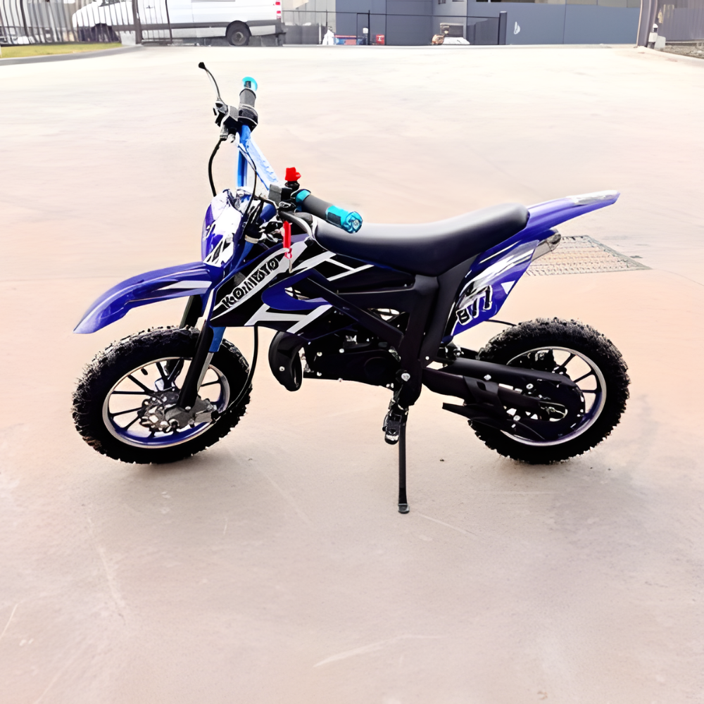 Blue and black dirt bike on a concrete surface with a blurred background