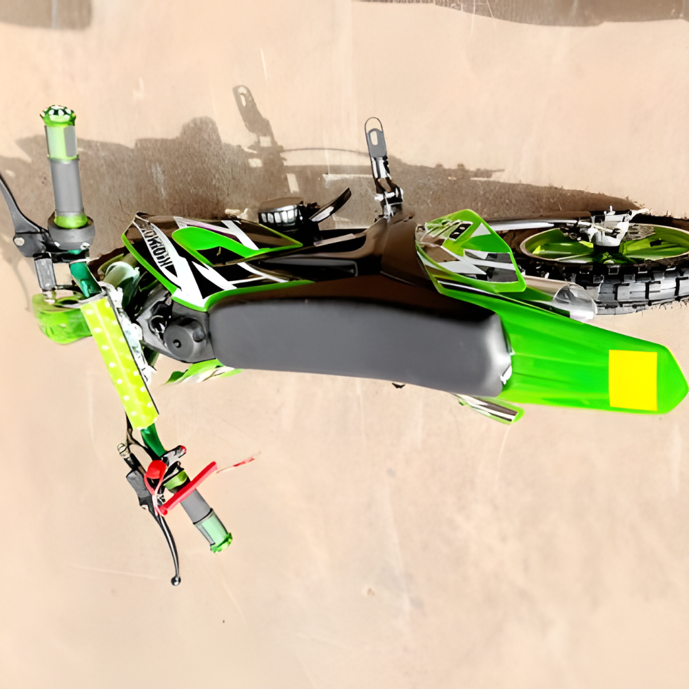 Close-up of a green and black motorcycle on a reflective surface