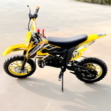 Yellow and black dirt bike on a sandy surface