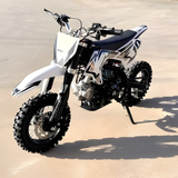 White dirt bike on a concrete surface