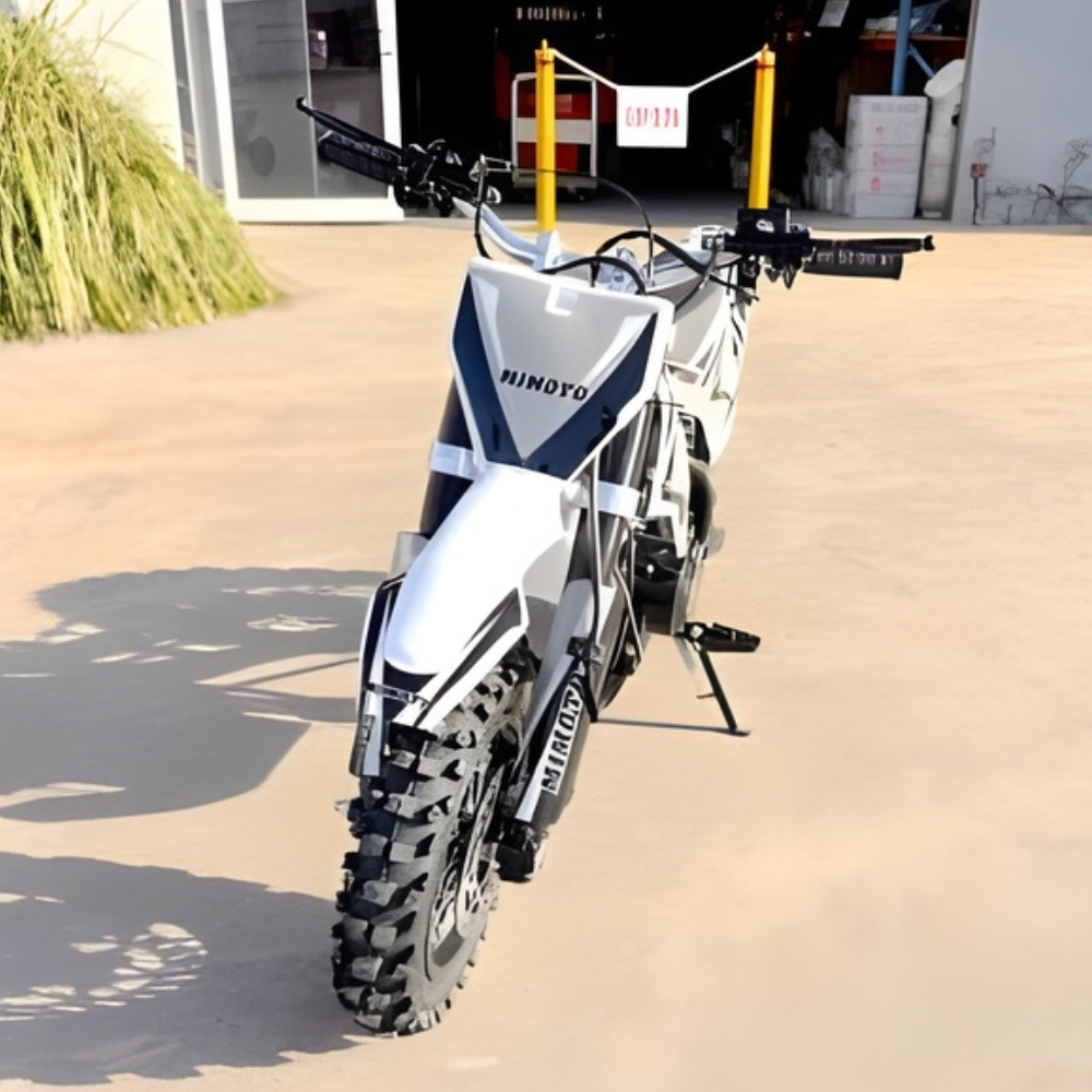 Dirt bike on a concrete surface with a blurred background