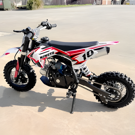 Small dirt bike with 'Mimoto' branding on a paved surface