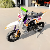 Colorful dirt bike with number 25 on a concrete surface