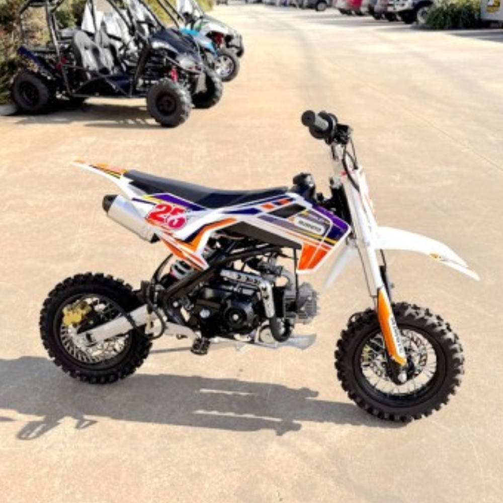 Small dirt bike with visible branding on a paved surface