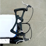 Close-up of bicycle handlebars with brake levers on a concrete surface