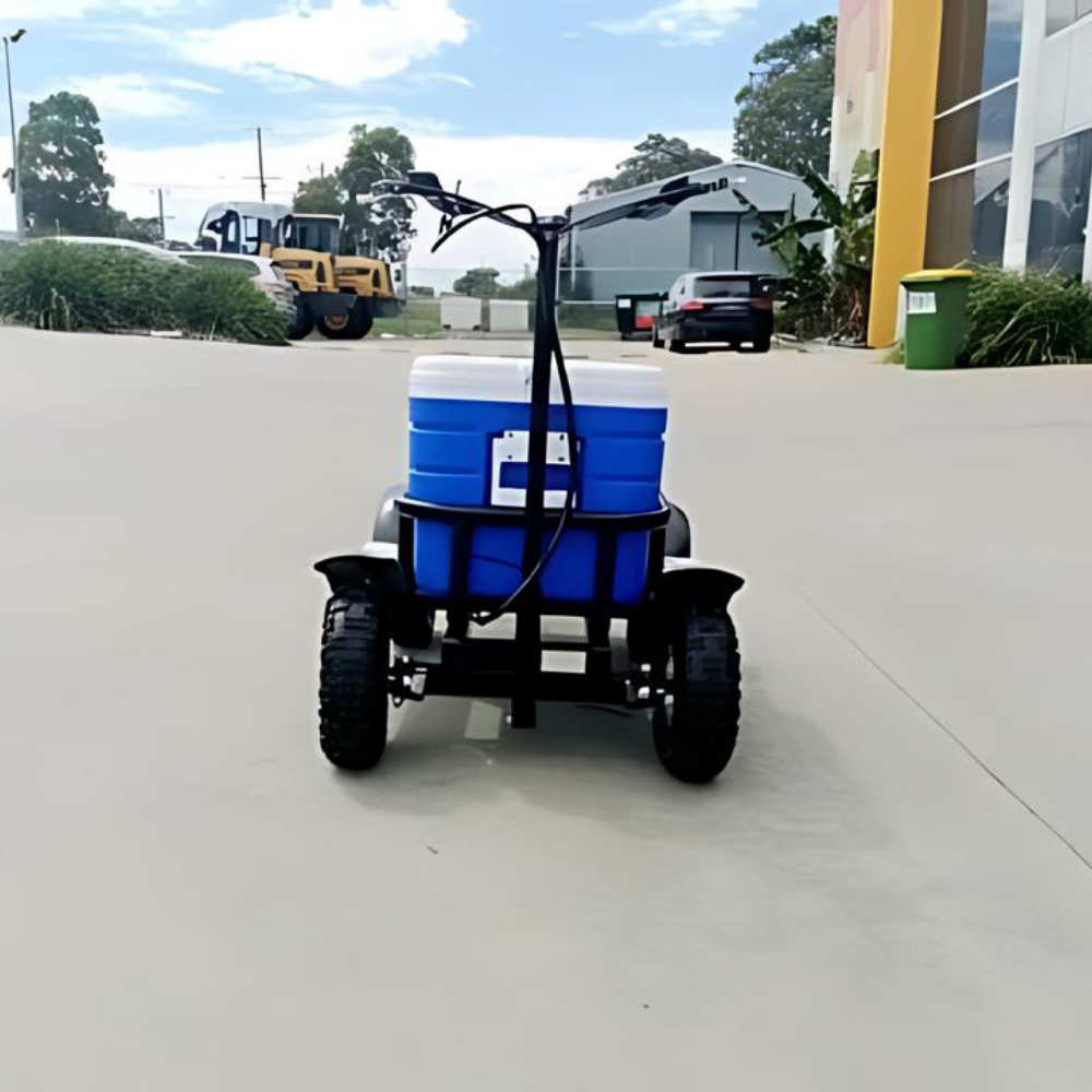 Small vehicle with a blue and white cooler on a concrete surface