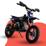 Front-angled studio shot of a blue and black 50cc kids’ dirt bike with number 86 graphics, displayed on a blue and grey backdrop.