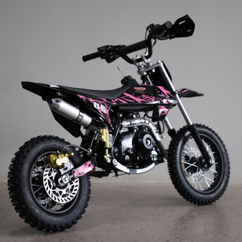 Side view of the 50cc dirt bike facing right, showcasing full body graphics and handlebar detail against a white background.