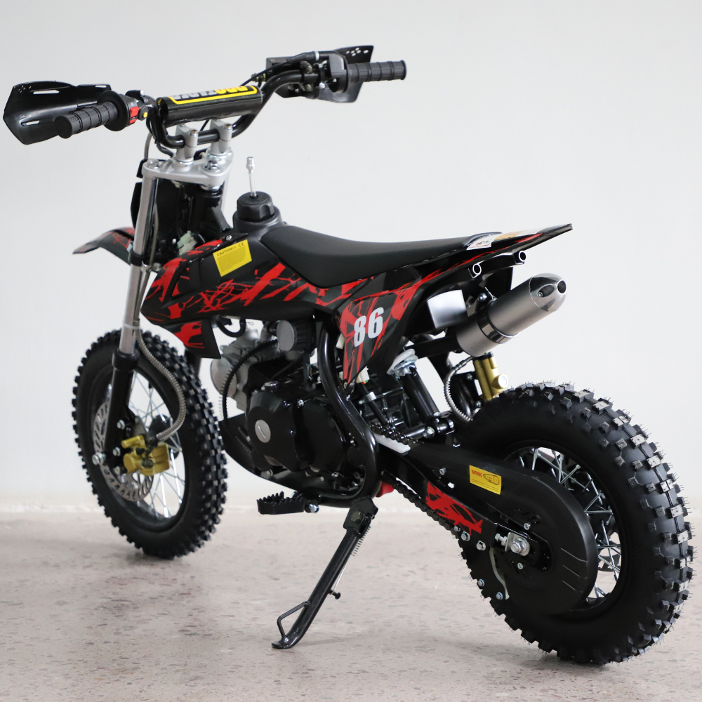 Left-side view of the dirt bike, showing kickstand down and full profile with visible engine and frame.

