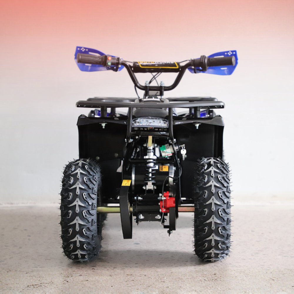 Small ATV or quad bike on a light background
