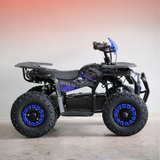 Black and blue ATV on a wooden floor with a gradient background