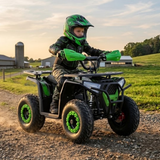 Child riding a green ATV in a rural setting with a sunset.