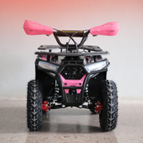 Pink and black ATV on a gray floor with a gradient pink to gray background
