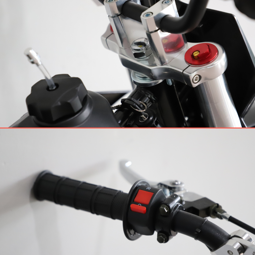 Close-up of a motorcycle handlebar area showing black grips, silver metal controls, and red switch details against a plain light background.