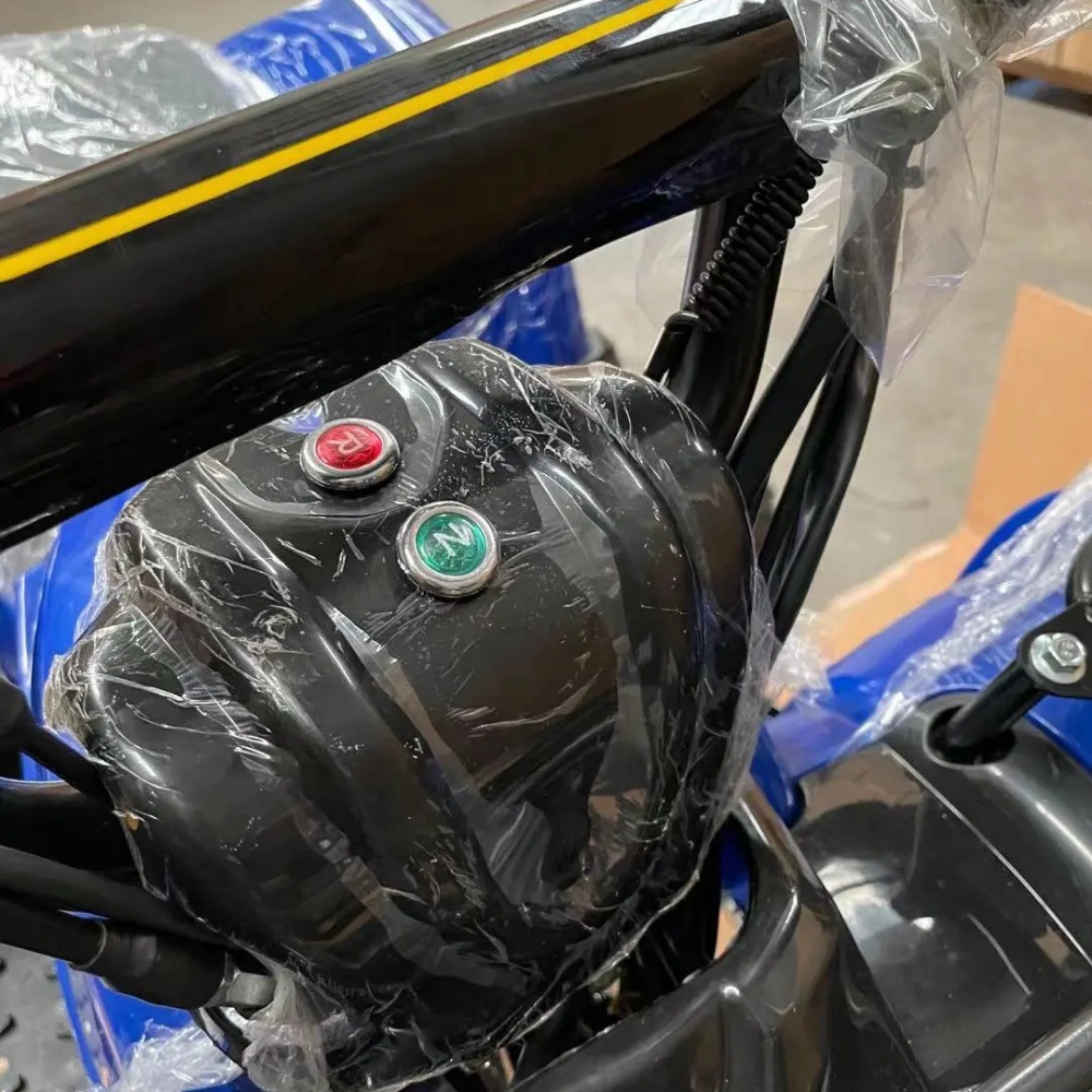 Close-up of engine controls, including red and green buttons on the frame.