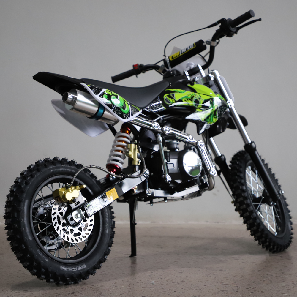 Green and black dirt bike on a gray background
