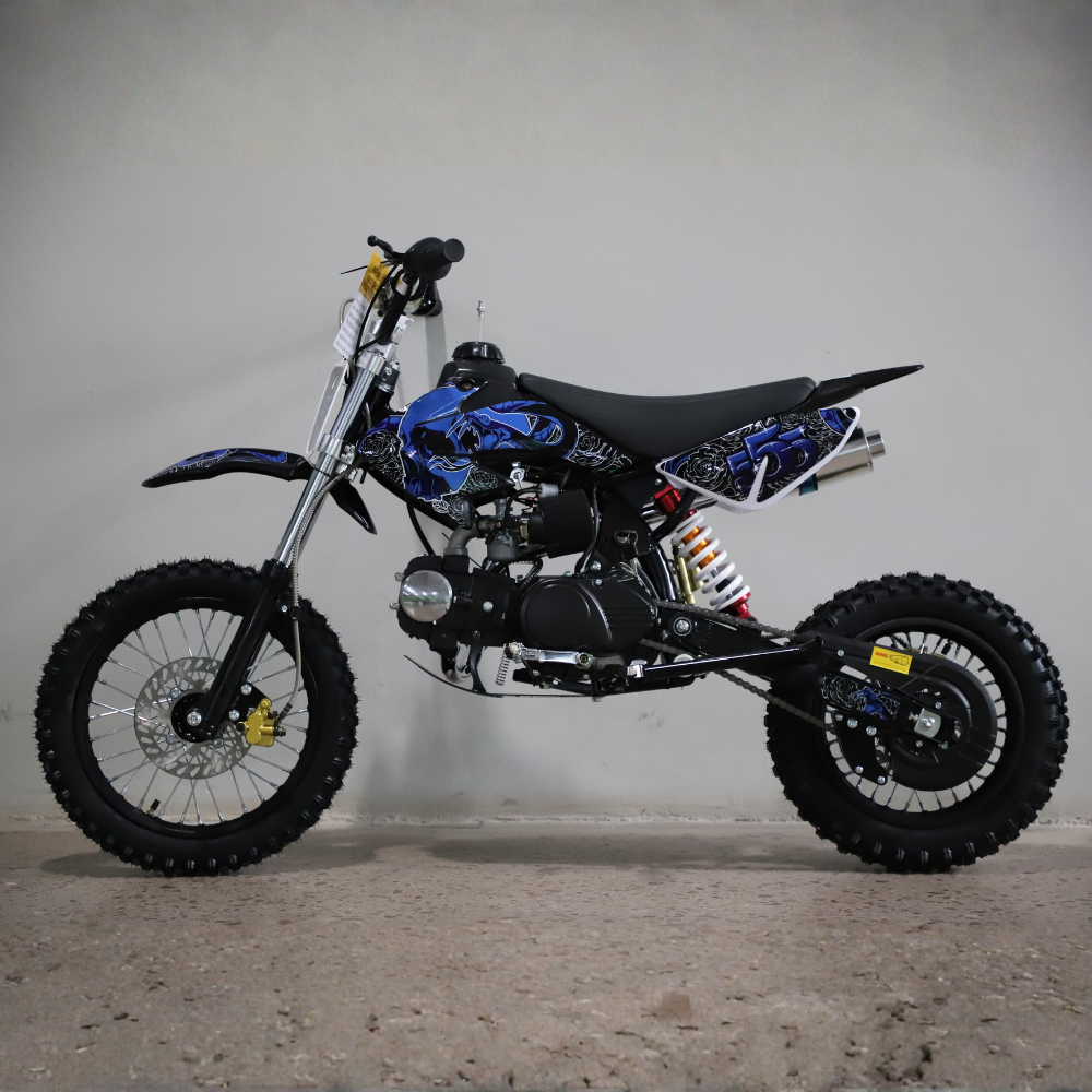 Small off-road motorcycle with a blue and black design on a gray background