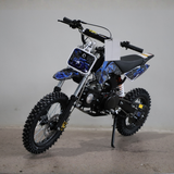 Children's dirt bike with blue and black design on a gray background