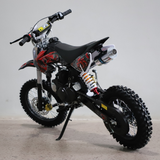 Black and red dirt bike on a gray background