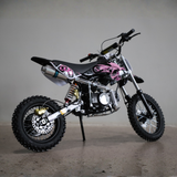 Small dirt bike with pink accents on a gray background
