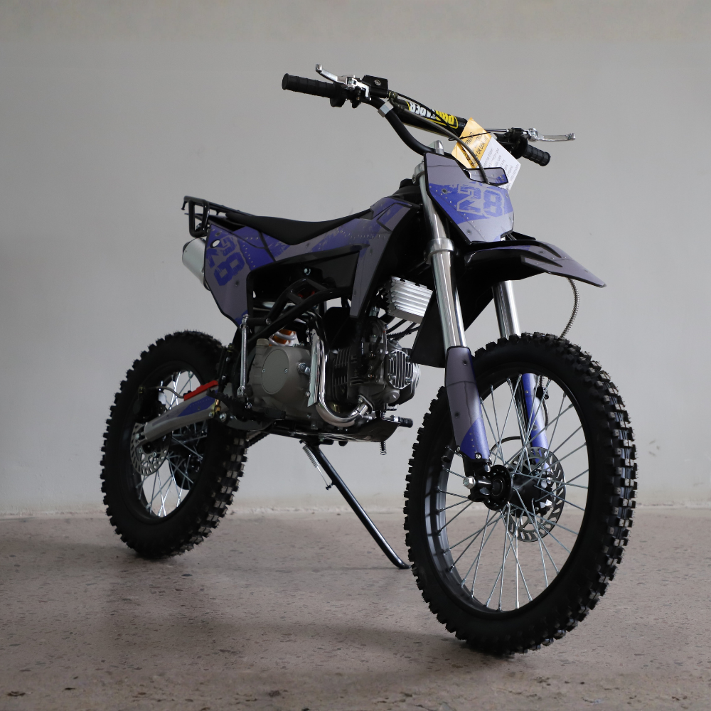 Front view of Motoworks 150cc Bigfoot Pro Petrol Powered 4-Stroke Kids Dirt Bike on concrete floor