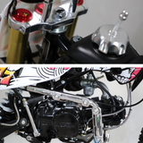 Close-up of LED tail light and exhaust pipe, highlighting the rear lighting system.
