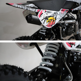 Engine and side frame detail, showing the kickstart, foot peg, and branding graphics.

