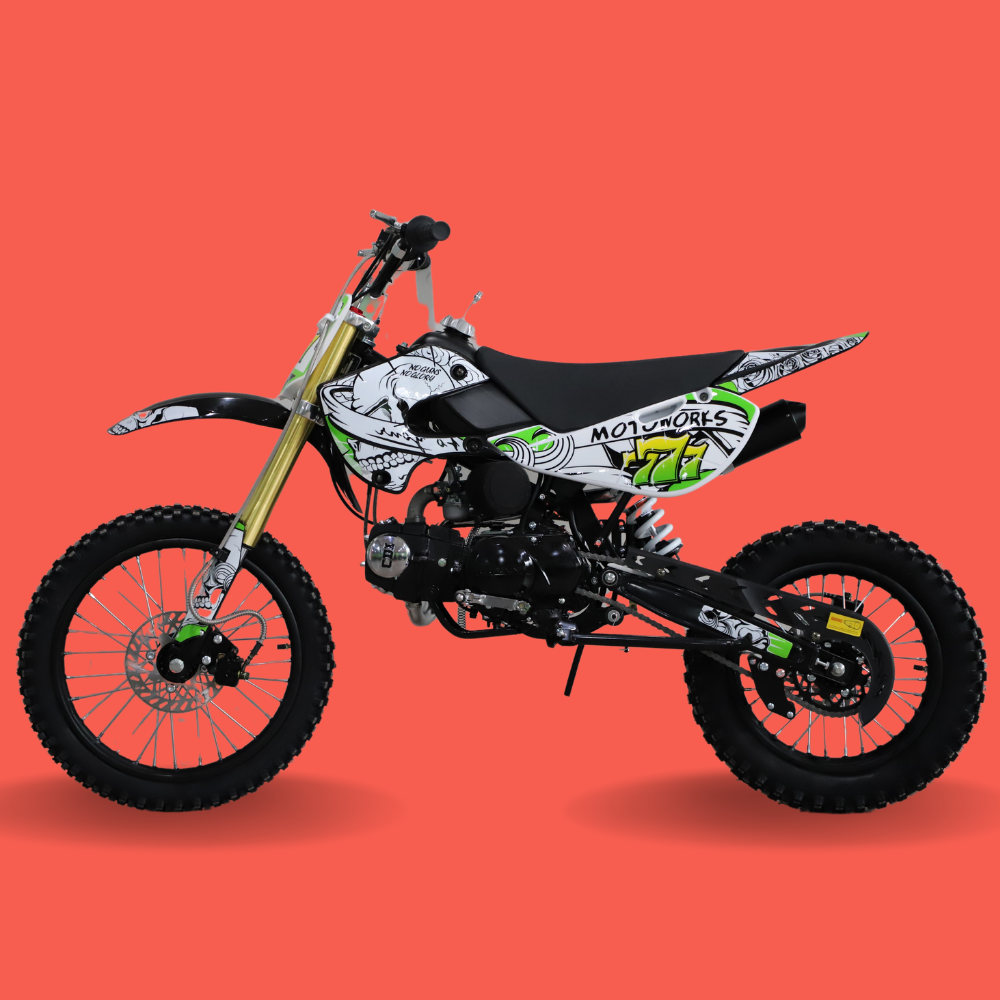 Side profile of kids’ dirt bike with green #276 graphics and gold forks, set against a red background.


